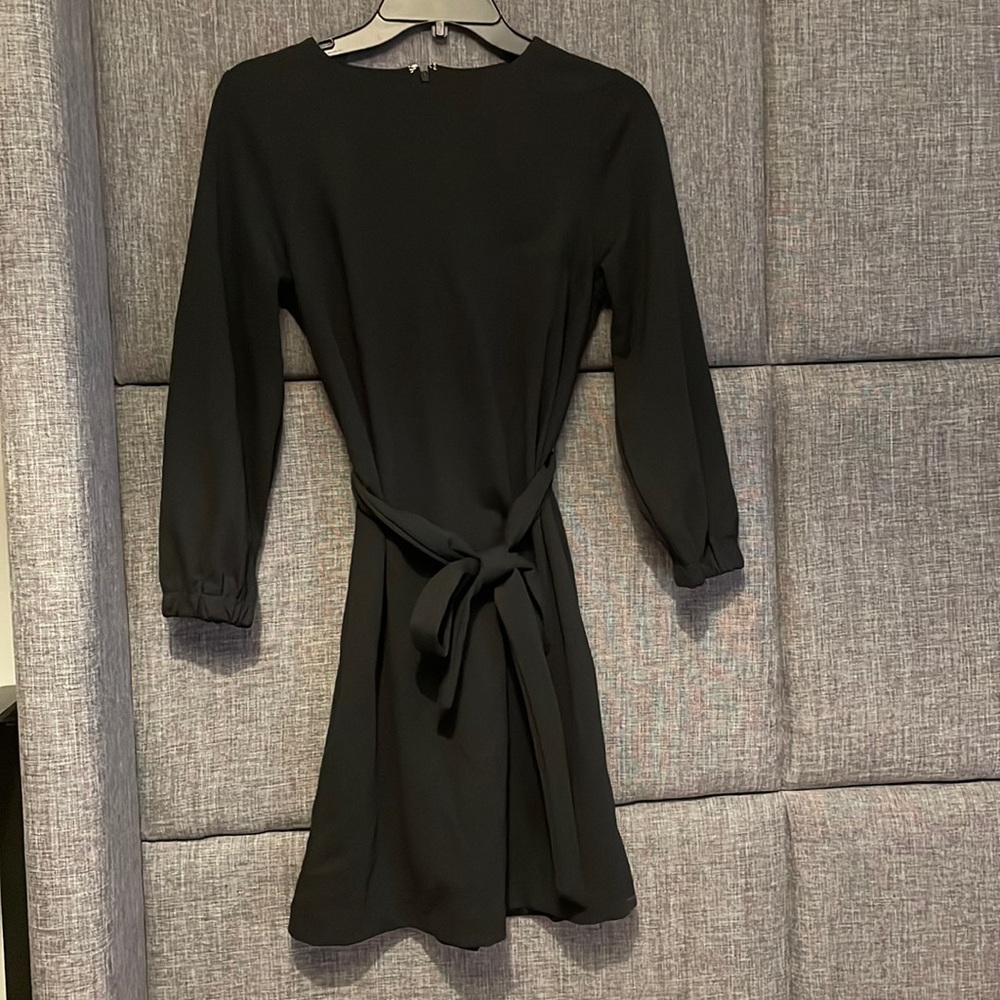 Gap black knee length dress. Tie waist. Never worn, brand new with tags size 0.